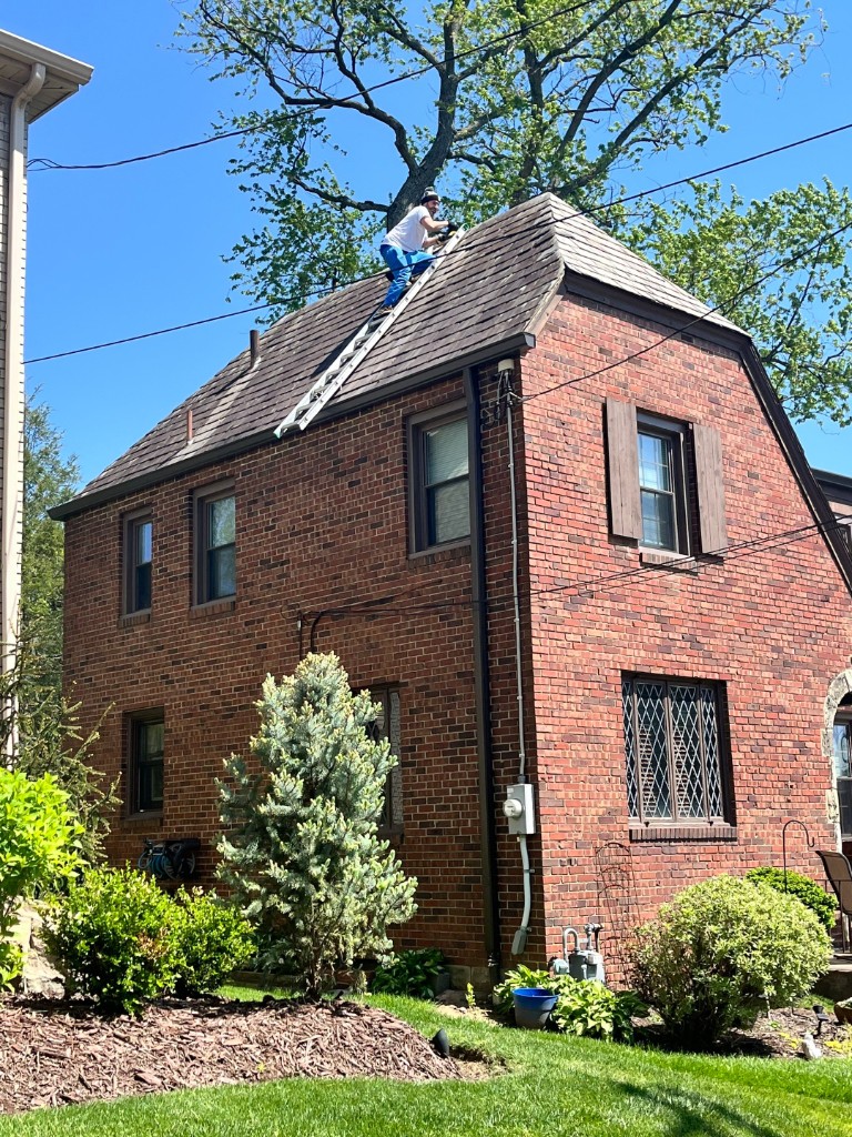 Professional roof inspection on brick Tudor home Sharon PA — TriState Home Consulting Group